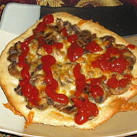 Małe pizze z pieczarkami